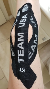 Taped knee for stability before a hike