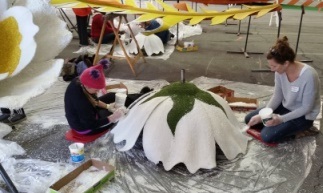 Affixing coconut flakes Rose Bowl Parade Float
